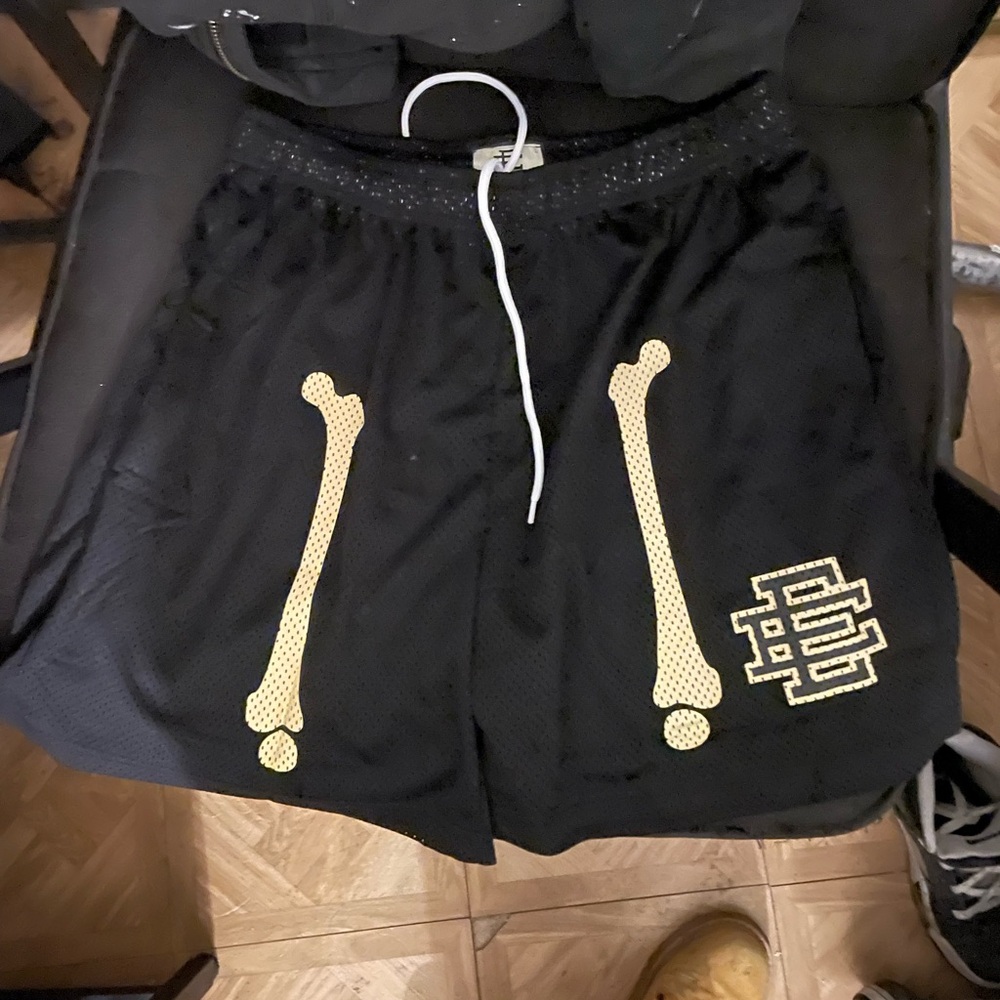 Black Mesh Shorts with Bone Design